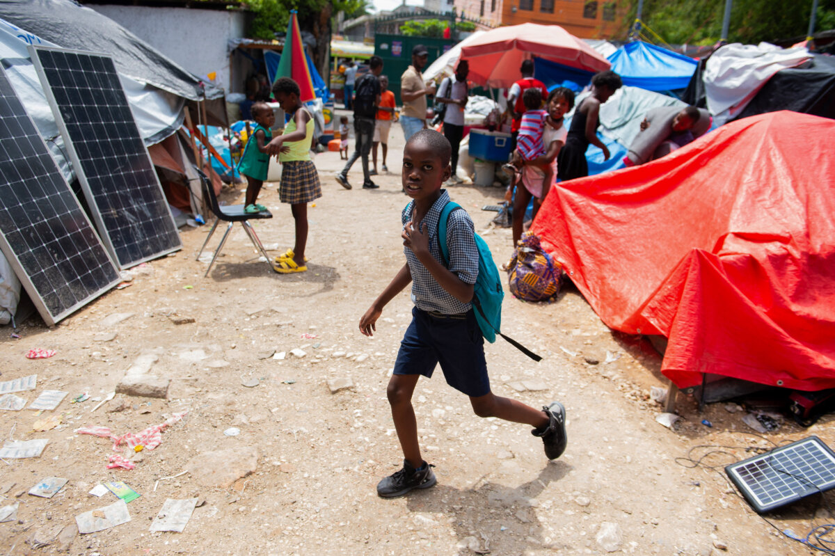 A child leaves for school from a displaced persons camp in Port-au-Prince, Haiti, on June 23, 2025. (Photo by Clarens Siffroy/AFP via Getty Images)