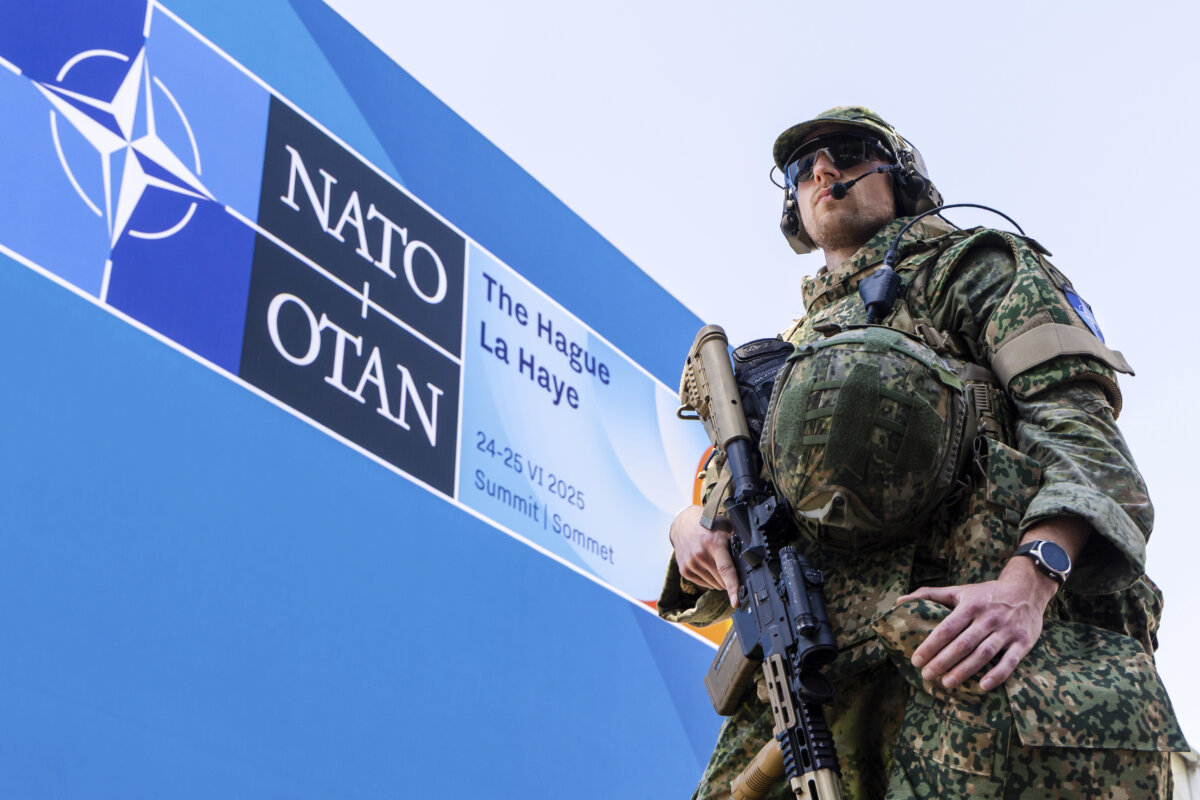 A Dutch soldier patrols around the perimeter of the NATO summit venue in The Hague, Netherlands, on June 23, 2025. (Geert Vanden Wijngaert/AP)