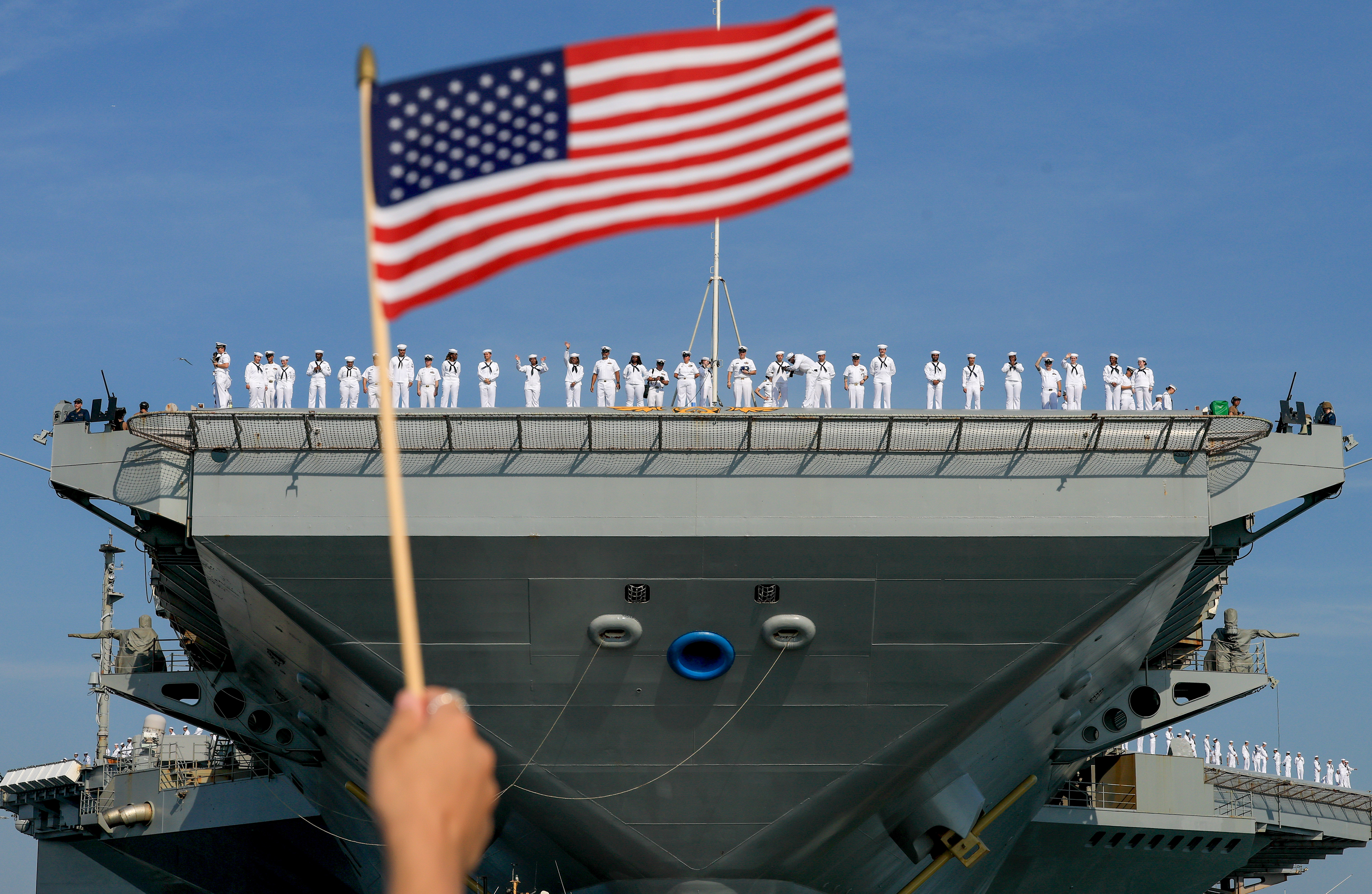 Day in Photos: Aircraft Carrier Departure, NATO Summit, and Olympic Cauldron Returns to Paris