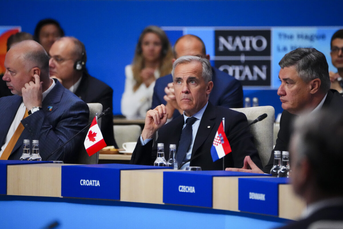Canadian Prime Minister Mark Carney, middle, takes part in a meeting of the North Atlantic Council during the NATO Summit in The Hague, Netherlands on June 25, 2025. (Sean Kilpatrick/The Canadian Press)