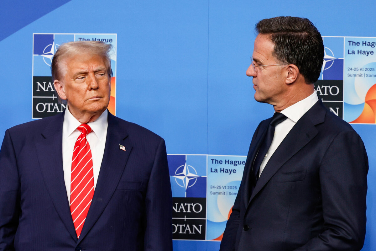 President Donald Trump (L) is greeted by NATO Secretary-General Mark Rutte at the NATO summit in The Hague, the Netherlands, on June 25, 2025. (Geert Vanden Wijngaert/AP)