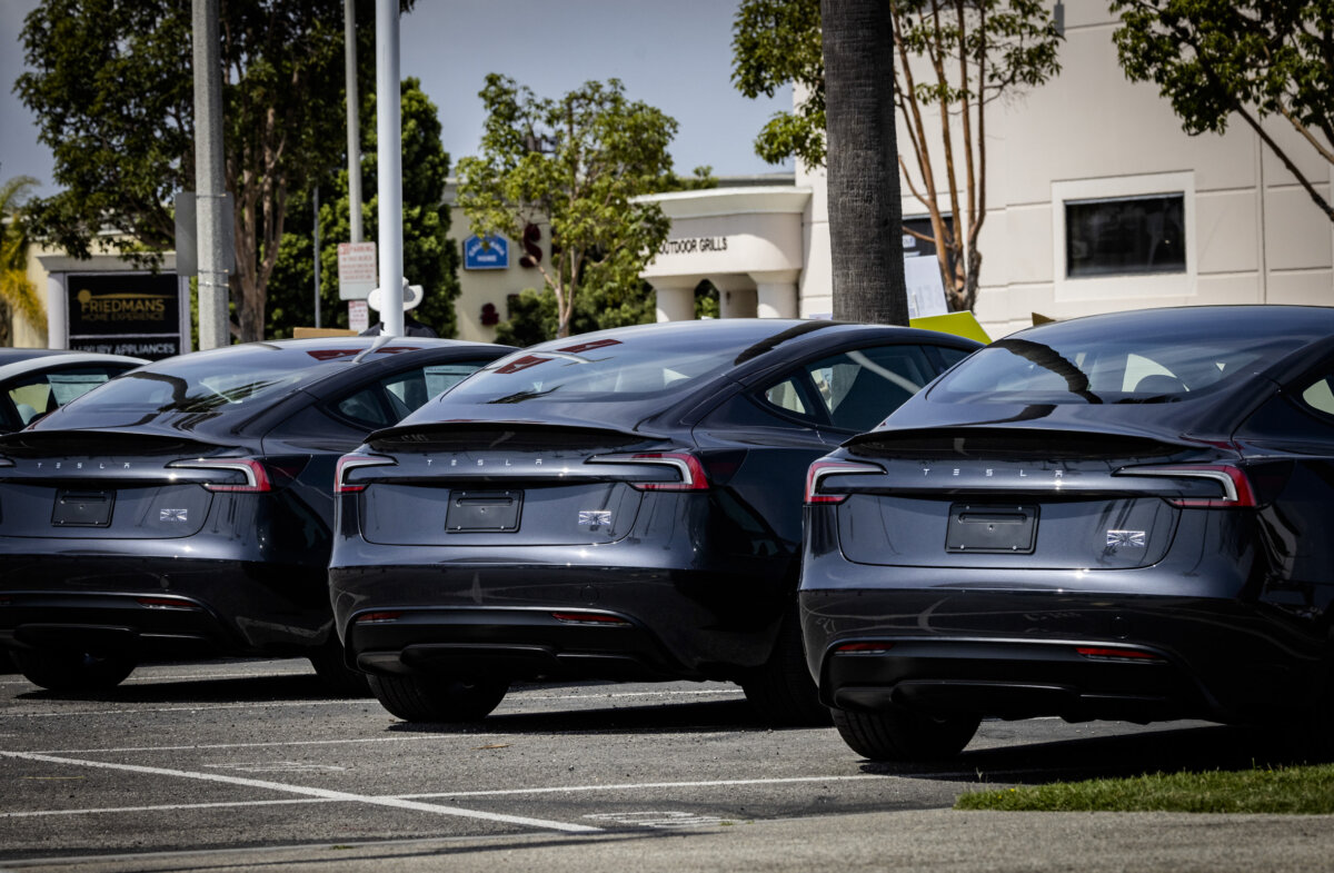 Tesla vehicles sit for sale at a Tesla dealership in Long Beach, Calif. (John Fredricks/The Epoch Times)