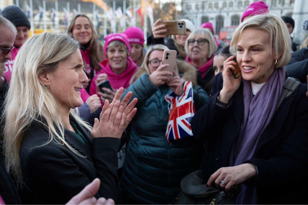 Kim Leadbeater (left) is joined by Esther Rantzen’s daughter Rebecca Wilcox (right) in Parliament Square after hearing the result of the vote in parliament for her Terminally Ill Adults (End of Life) Bill, in London, England, on Nov. 29, 2024. (Stefan Rousseau/PA Wire)