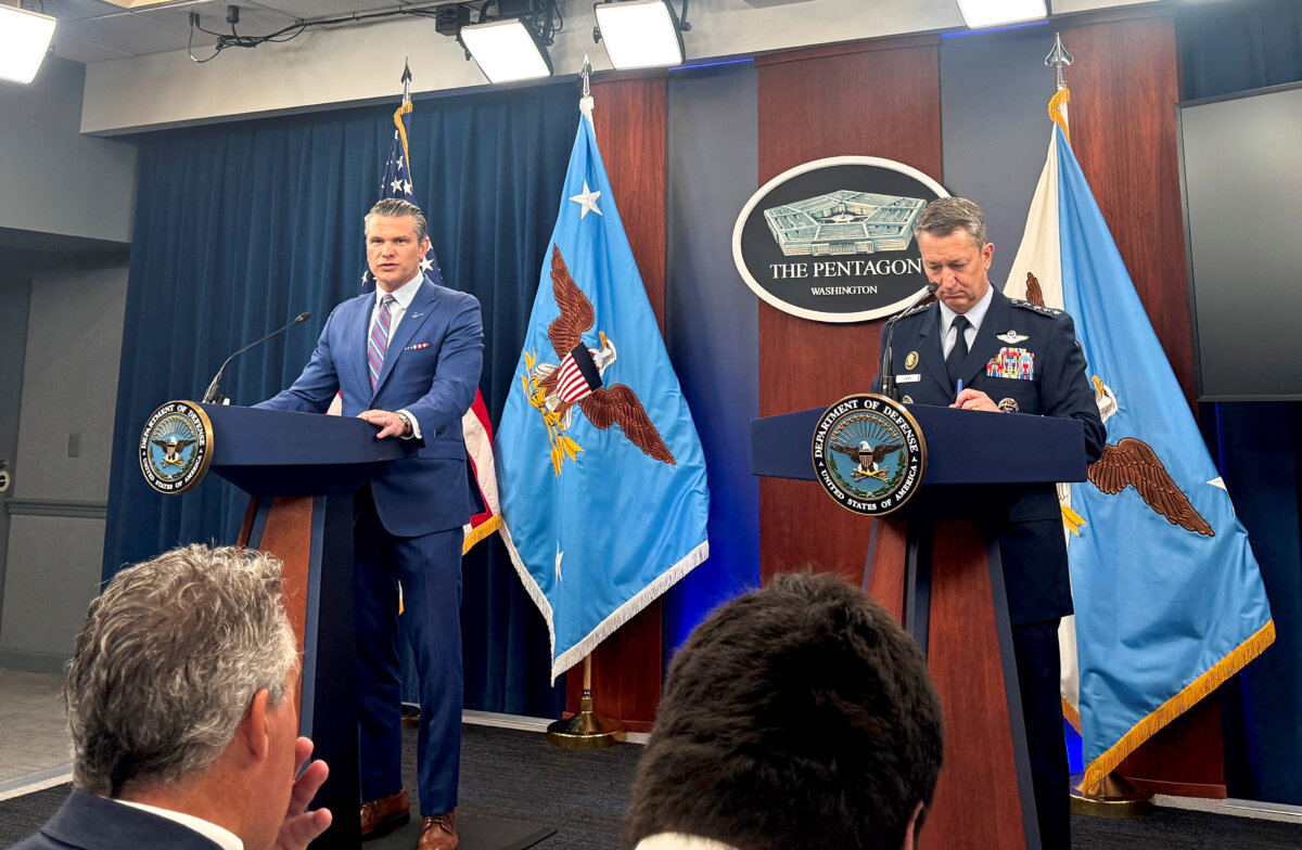 Defense Secretary Pete Hegseth (L) and Chairman of the Joint Chiefs of Staff Air Force Gen. Dan Caine, speak during a press conference at the Pentagon in Arlington, Va., on June 26, 2025. (Idrees Ali/Reuters)