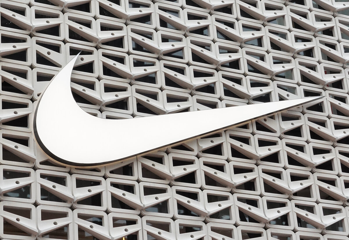 The Nike logo above the entrance to a store in Miami Beach, Fla., on Dec. 21, 2021. (Joe Raedle/Getty Images)