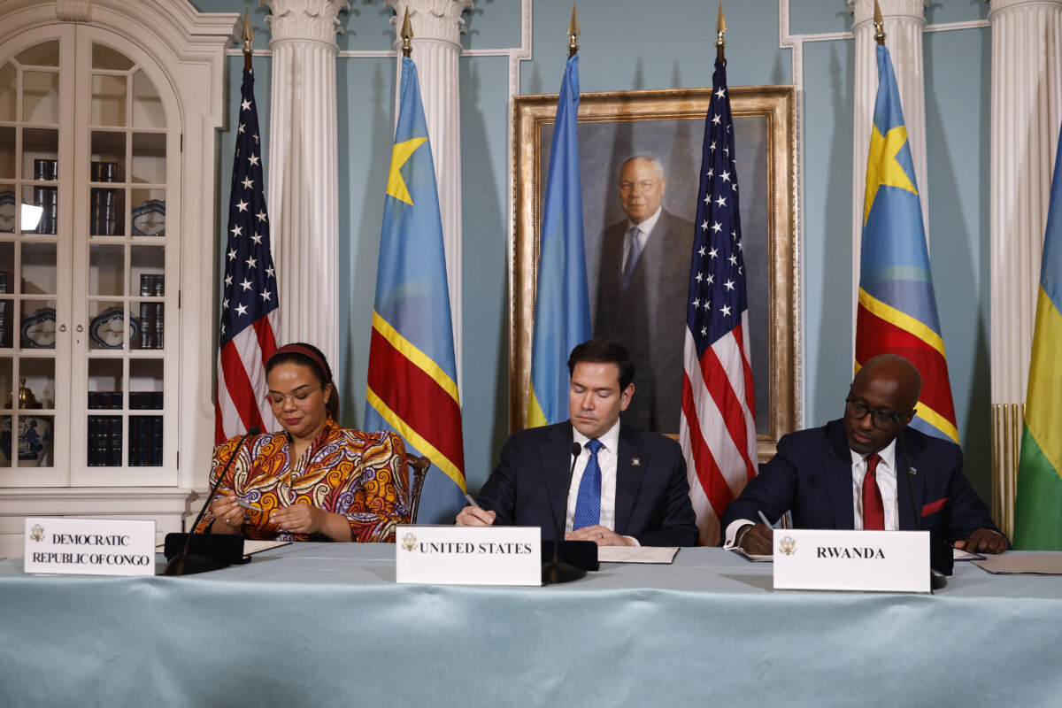Secretary of State Marco Rubio (C); Thérèse Kayikwamba (L), foreign minsiter of the Democratic Republic of the Congo; and Rwandan Foreign Minister Olivier Nduhungirehe participate in a Declaration of Principles signing ceremony at the State Department in Washington on April 25, 2025. (Kevin Dietsch/Getty Images)