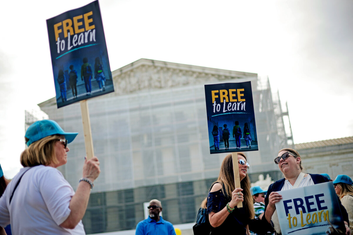 Supporters for school choice hold signs outside the U.S. Supreme Court in Washington on April 30, 2025. (Alex Wong/Getty Images)