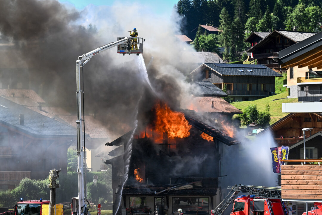 Day in Photos: Fire in Switzerland, Armed Forces Day, and Protests in Thailand