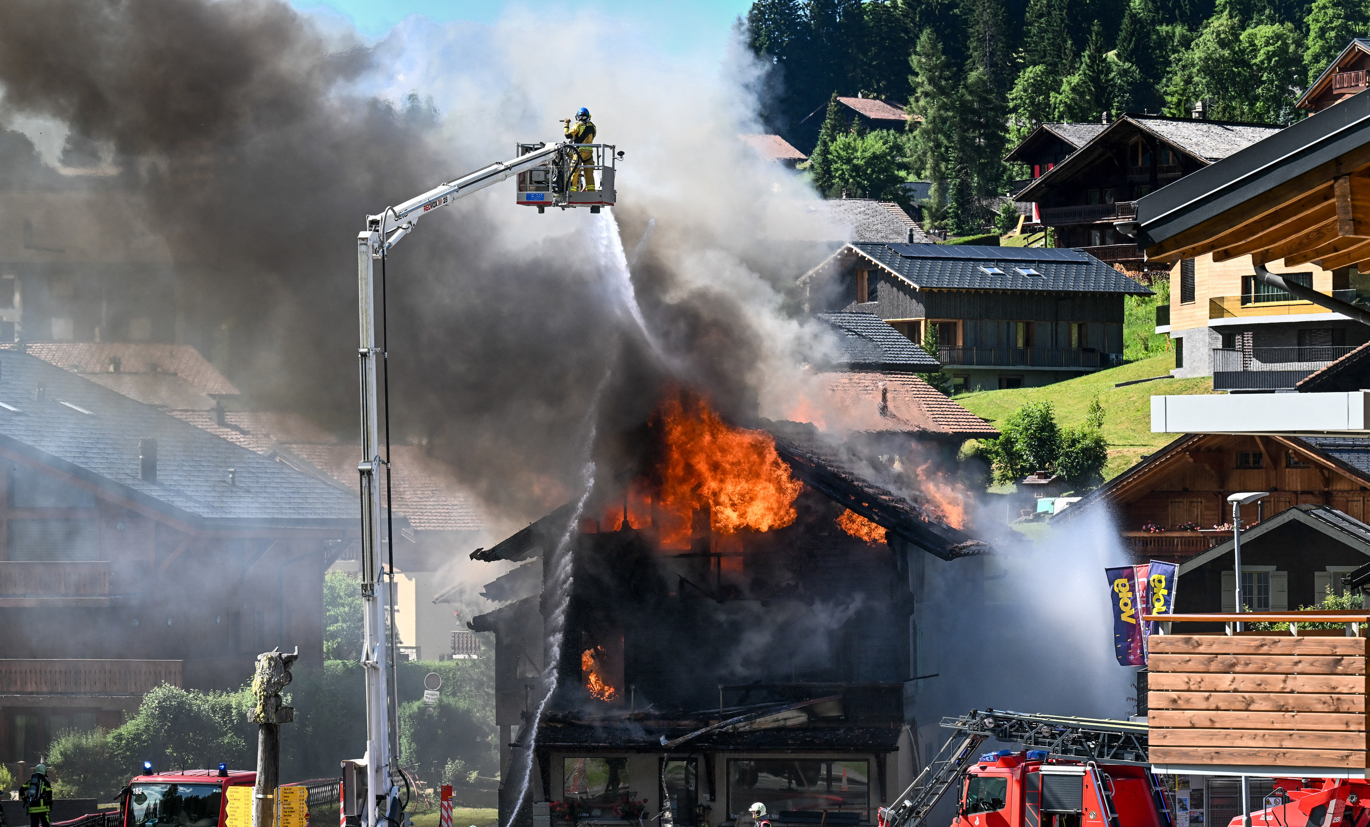 Day in Photos: Fire in Switzerland, Armed Forces Day, and Protests in Thailand