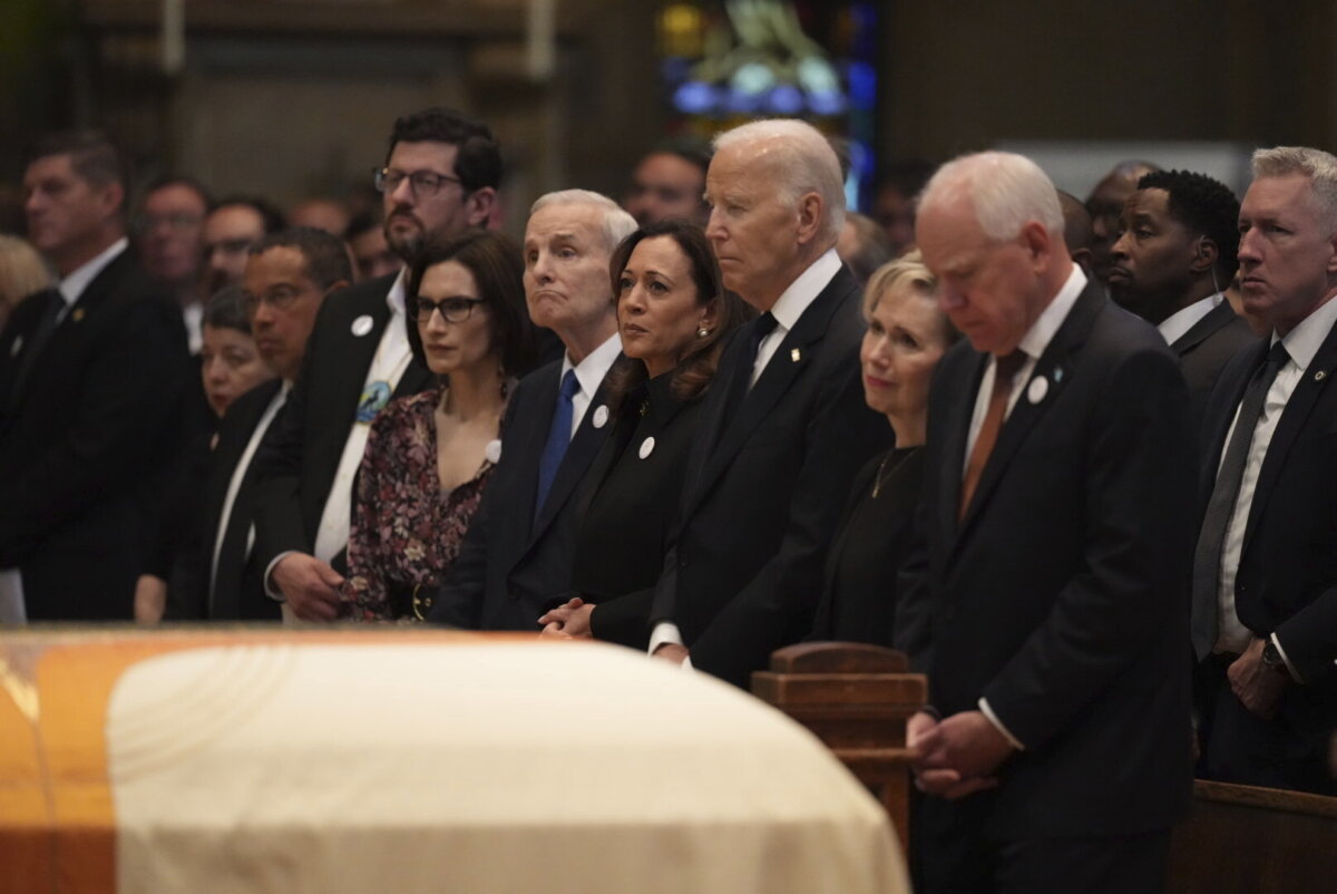 (L–R) Minnesota attorney general Keith Ellison, Tom Weber, Lt. Gov. Peggy Flanagan, former Minnesota Gov. Mark Dayton, former Vice President Kamala Harris, former President Joe Biden, Gwen Walz and Minnesota Gov. Tim Walz attend funeral services for Mark and Melissa Hortman at the Basilica of St. Mary in Minneapolis, Minn., on June 28, 2025. (Alex Kormann/Star Tribune via AP, Pool)