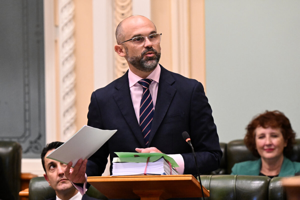 Queensland Treasurer David Janetzki (centre) delivering the 2025-26 Queensland state budget at Queensland Parliament in Brisbane, Australia on June 24, 2025. (AAP Image/Darren England)
