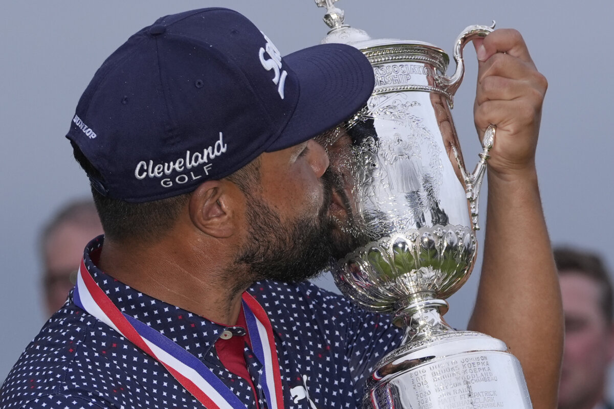 J.J. Spaun celebrates with the trophy after winning the U.S. Open golf tournament at Oakmont Country Club in Oakmont, Pa., on June 15, 2025. (Carolyn Kaster/AP Photo)
