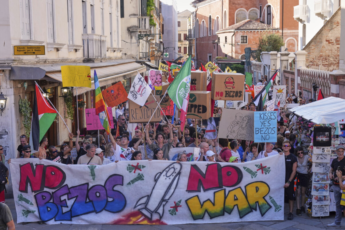 Activists stage a protest in Venice, Italy, on June 28, 2025, denouncing the three-day celebrations for the wedding between Jeff Bezos and his wife Lauren Sanchez Bezos that took place in Venice on June 27. (Antonio Calanni/AP Photo)