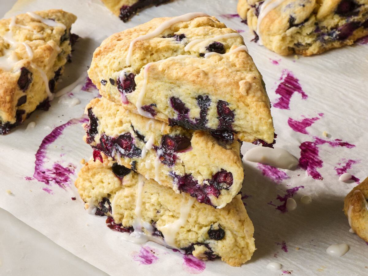 Tender, buttery scones are packed with fresh blueberries and finished with a lemony glaze. (Alex Lepe/TCA)
