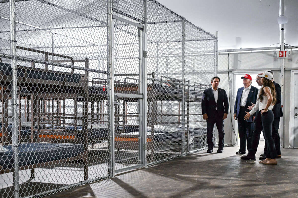 President Donald Trump (2nd L), Florida Gov. Ron DeSantis (L), and Secretary of Homeland Security Kristi Noem (R) tour a detention center, dubbed “Alligator Alcatraz,” located at the site of the Dade-Collier Training and Transition Airport in Ochopee, Fla., on July 1, 2025. (Andrew Caballero-Reynolds/AFP via Getty Images)