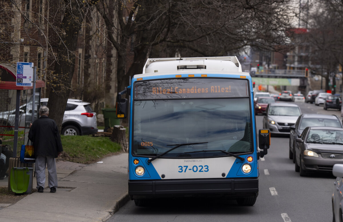 A bus is seen with the expression "Allez! Canadiens Allez!" in Montreal on April 24, 2025. (The Canadian Press/Christinne Muschi)