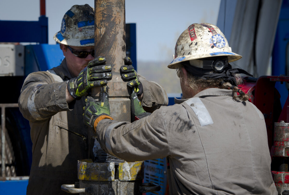 Workers change pipes at a gas drilling rig exploring the Marcellus Shale outside Waynesburg, Pa. (Mladen Antonov/AFP via Getty Images)