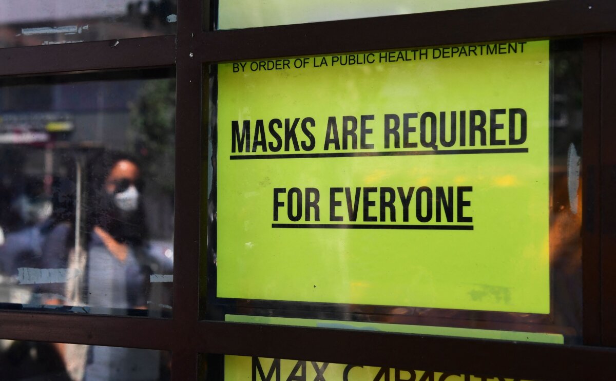 A storefront sign in Los Angeles on July 19, 2021. (Frederic J. Brown/AFP via Getty Images)