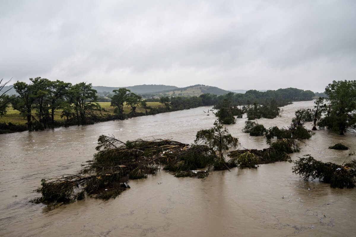 Trees emerge from flood waters along the Guadalupe River in Kerrville, Texas, on July 4, 2025. (Eric Vryn/Getty Images)