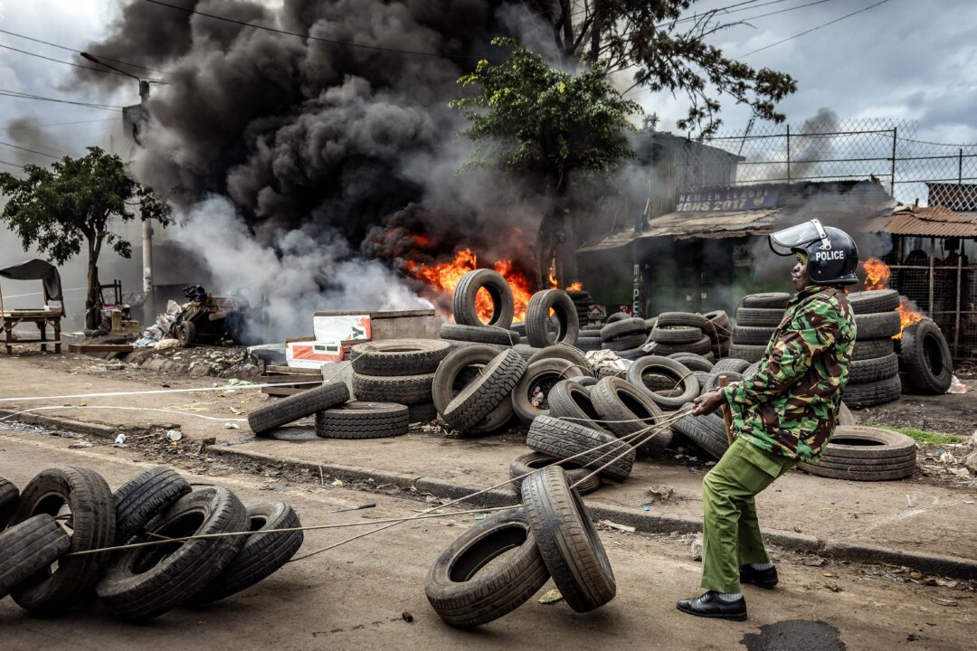 Day in Photos: Unrest in Kenya, Festival of San Fermin, Typhoon in Taiwan
