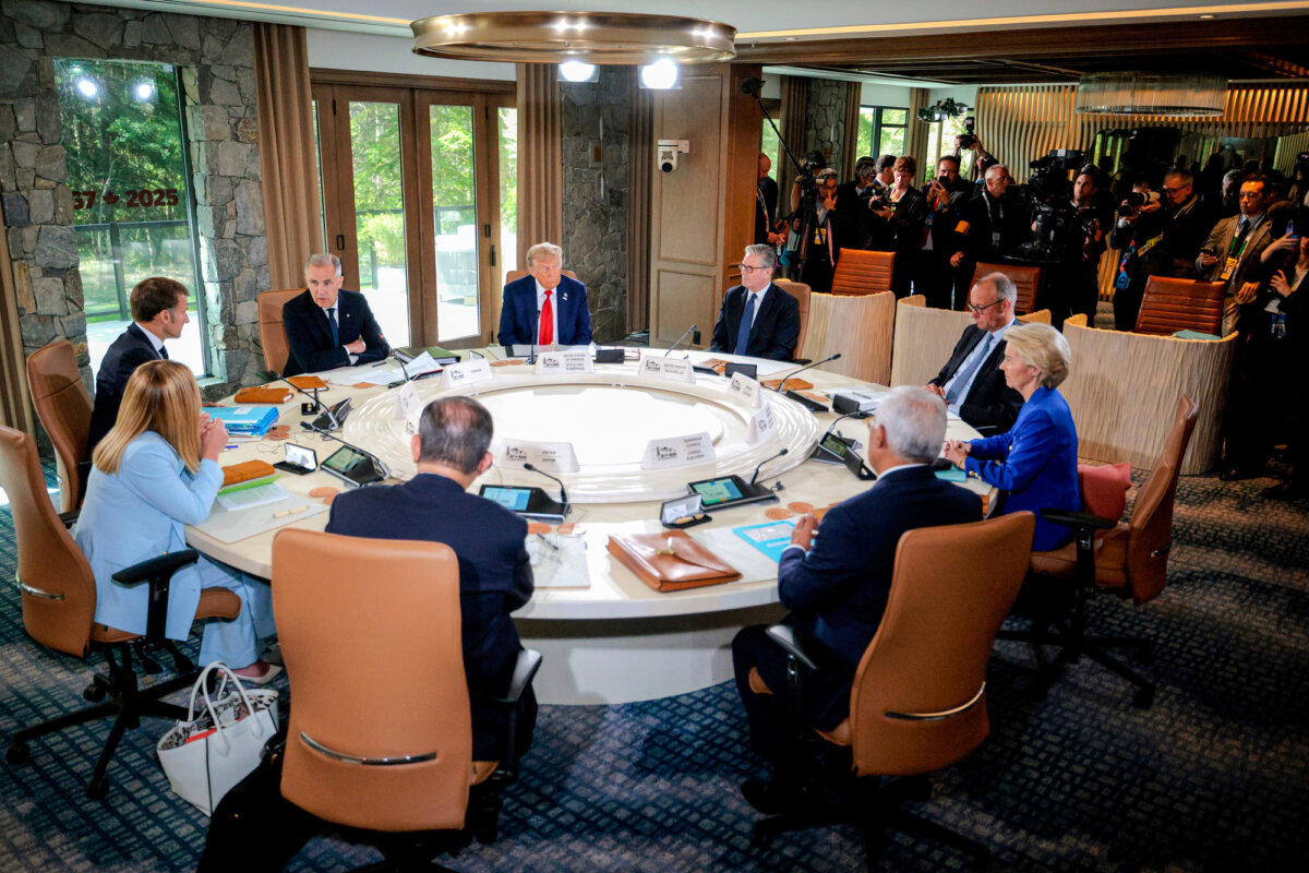 (L–R) Italian Prime Minister Giorgia Meloni, French President Emmanuel Macron, Canadian Prime Minister Mark Carney, U.S. President Donald Trump, British Prime Minister Keir Starmer, German Chancellor Friedrich Merz, European Commission President Ursula von der Leyen, European Council President Antonio Costa, and Japanese Prime Minister Shigeru Ishiba meet at the G7 Leaders' Summit in Kananaskis, Canada, on June 16, 2025. (Chip Somodevilla/Getty Images)