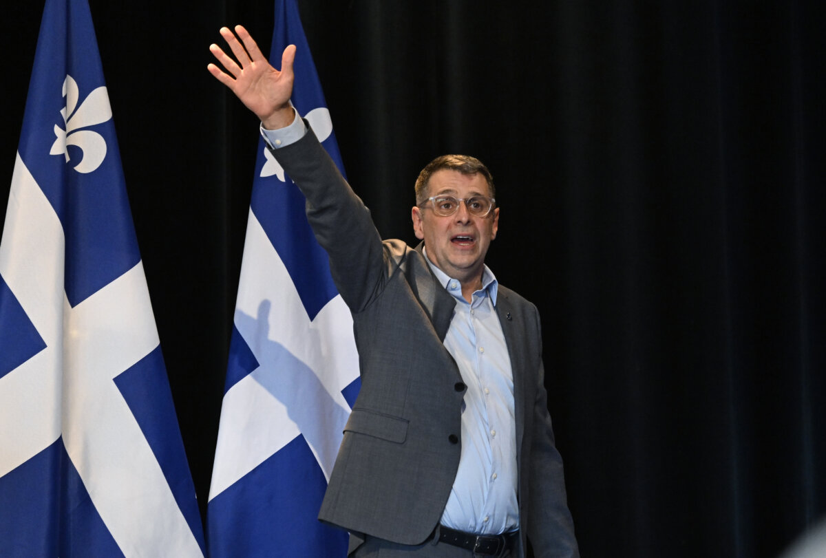 The leader of the Conservative Party of Quebec, Éric Duhaime, greets his supporters during a rally in Victoriaville, Que., on May 4, 2025. (The Canadian Press/Jacques Boissinot)