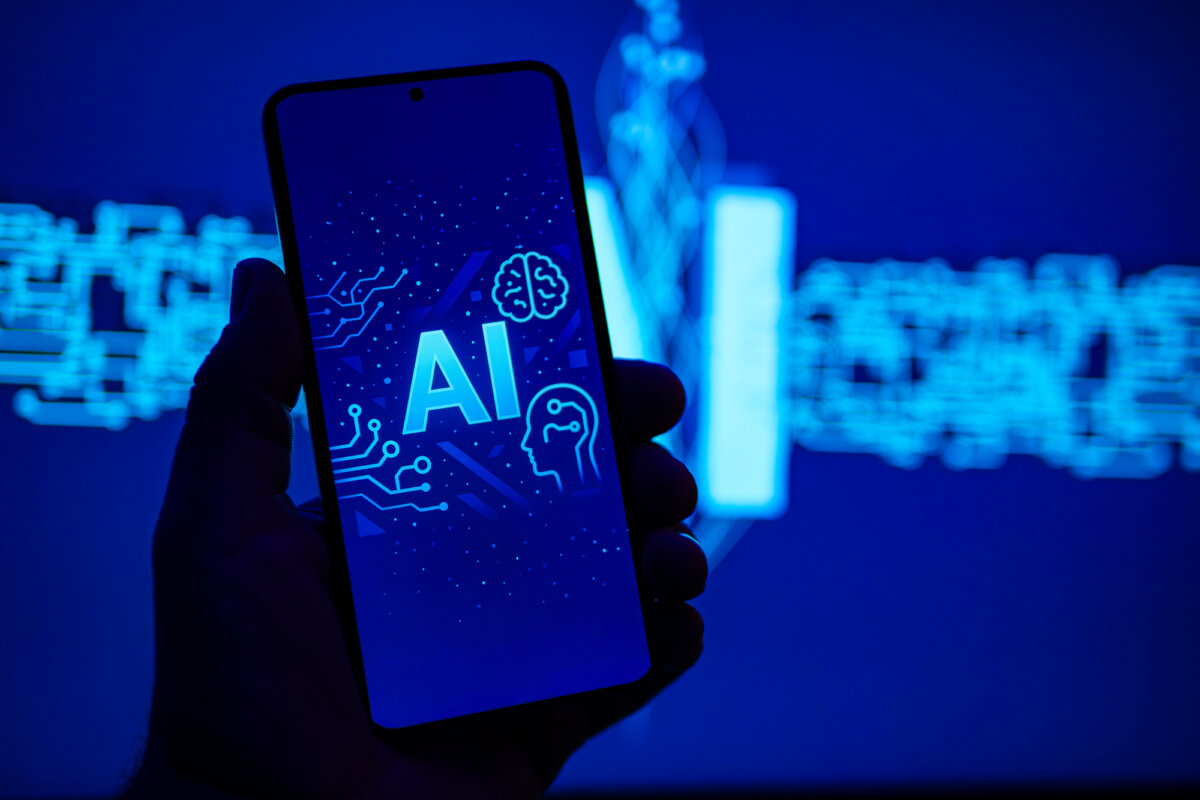 An AI logo on a cellphone screen on May 16, 2025, in this photo illustration. AI use in customer service is rising, with 70 percent of interactions expected to involve AI in 2025, according to Wifi Talents. (Oleksii Pydsosonnii/The Epoch Times)