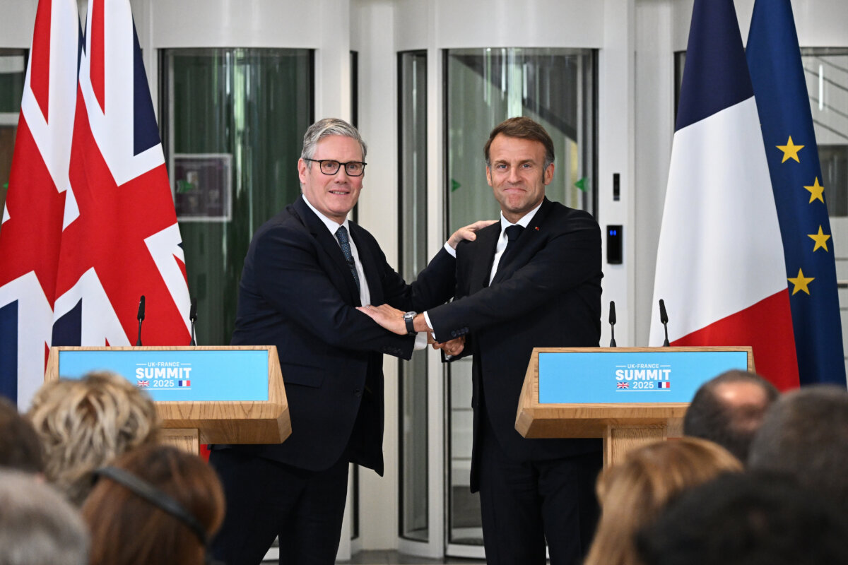 British Prime Minister Keir Starmer (L) and French President Emmanuel Macron shake hands as they hold a news conference during a joint military visit to the Allied Maritime Command (MARCOM) center in Northwood, London, on July 10, 2025. (Leon Neal/PA)