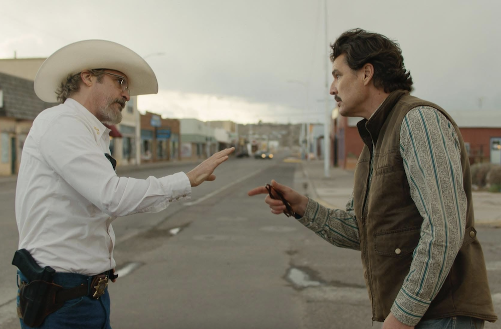 Sheriff Joe Cross (Joaquin Phoenix, L) and mayor Ted Garcia argue about mask-wearing in "Eddington." (A24)