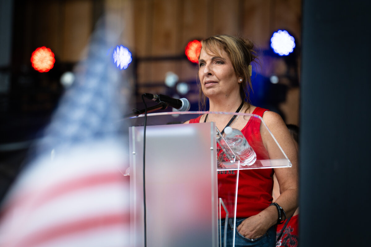 Helen Comperatore speaks before a concert by Gary Buck III in honor of Corey Comperatore in Russellton, Pa., on July 12, 2025. (Samira Bouaou/The Epoch Times)