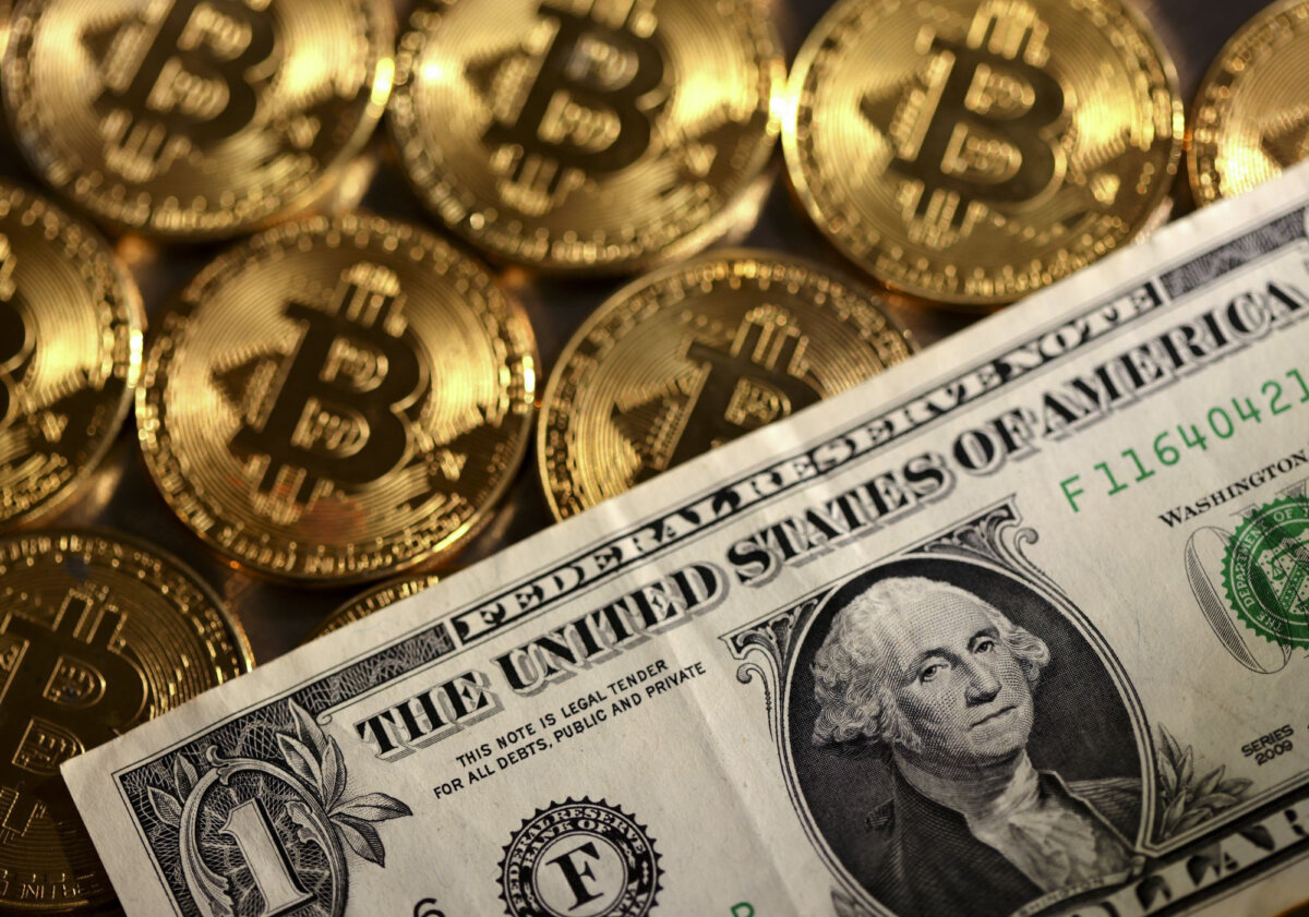 Representations of cryptocurrency bitcoin and the U.S. dollar, in this illustration taken on Aug. 10, 2022. (Dado Ruvic/Reuters)