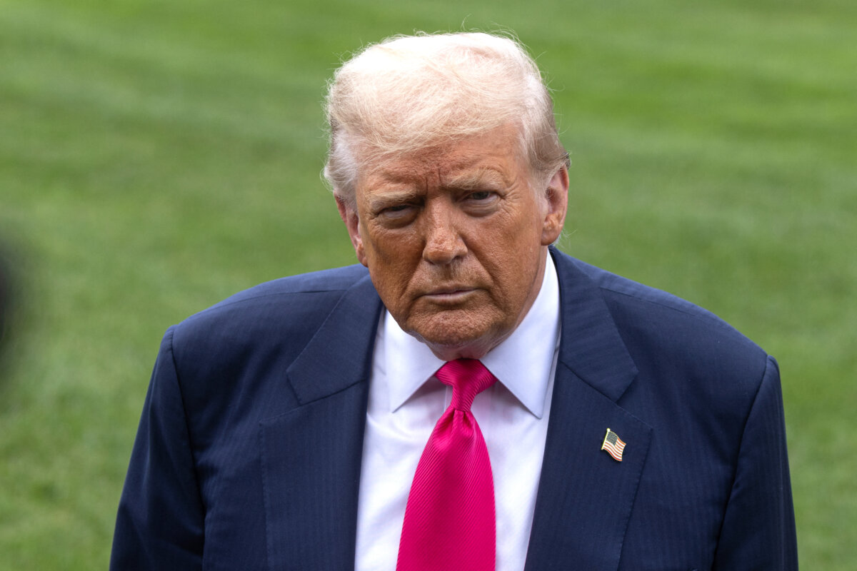 President Donald Trump speaks with members of the media before boarding Marine One on the South Lawn of the White House on July 15, 2025. (Mehmet Eser/Middle East Images via AFP via Getty Images)