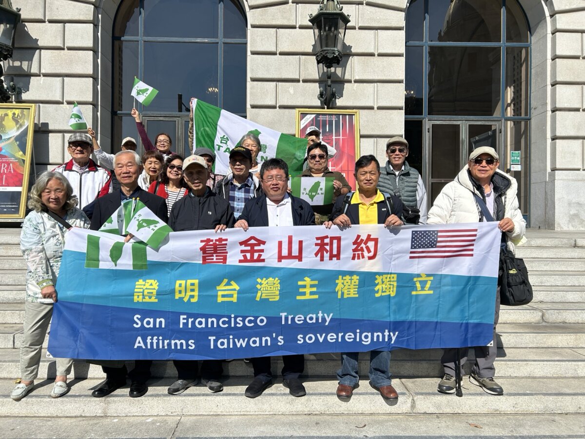 A visiting group from Taiwan celebrates the 74th anniversary of the Treaty of San Francisco in front of the San Francisco War Memorial Opera House on July 14, 2025. (Nathan Su/The Epoch Times)