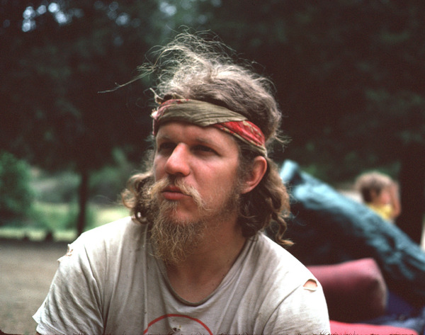 man with red headband in Commune
