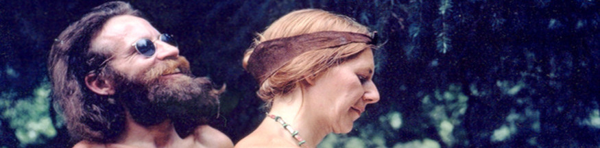 bearded man and woman in forest in Commune
