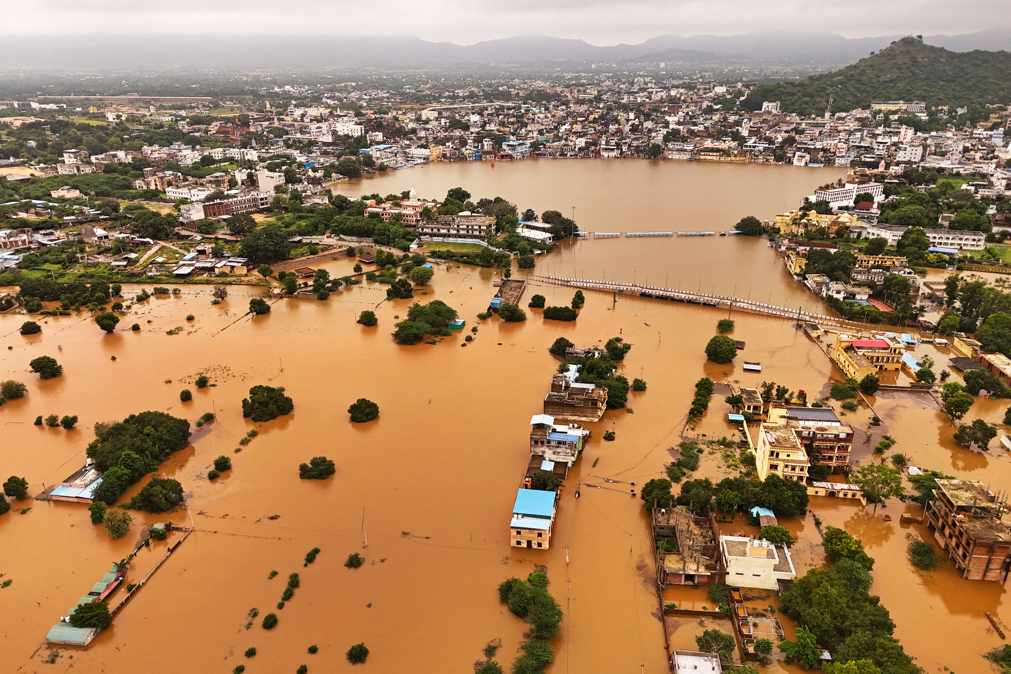 Day in Photos: Floods in India, Vehicle Drives Into Crowd, and 125th Anniversary of Paris Metro