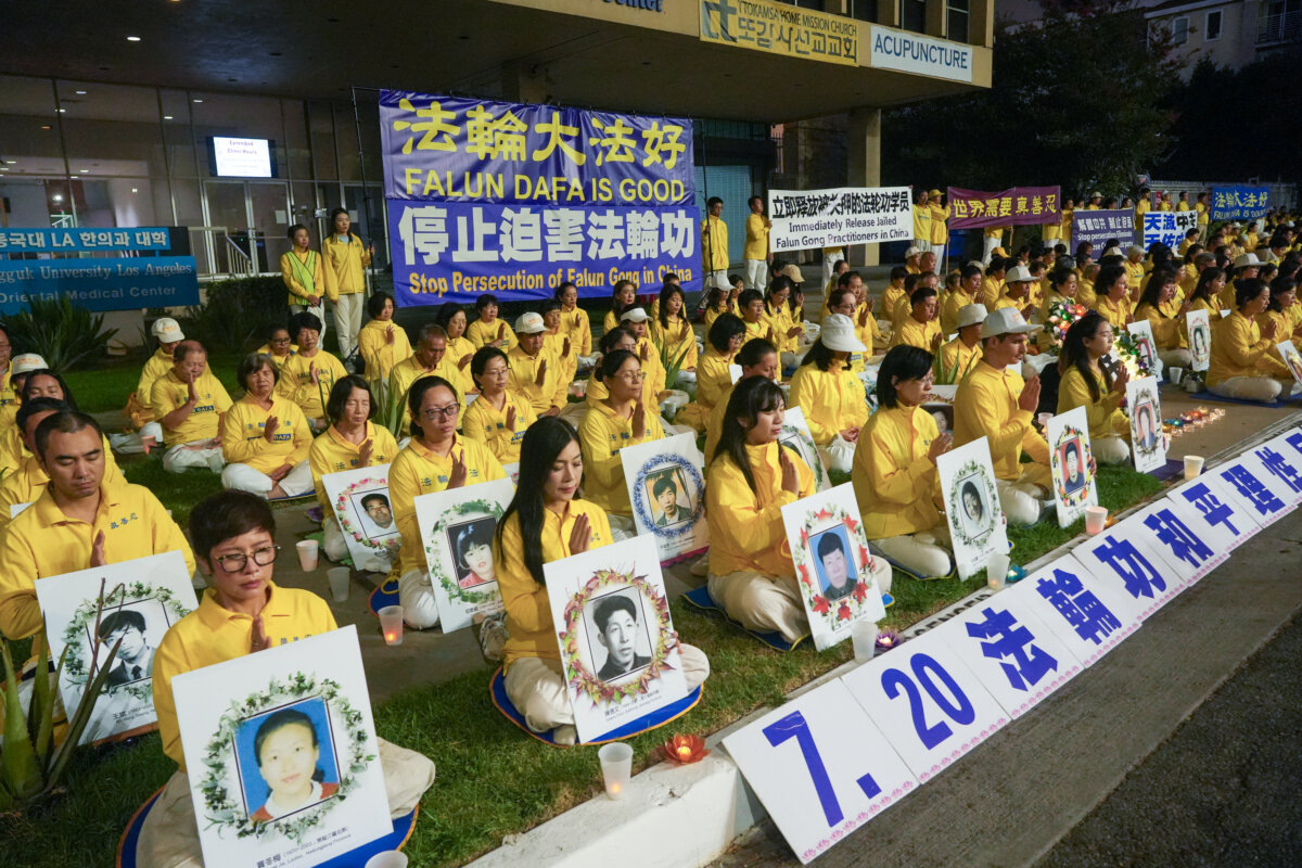 Falun Gong practitioners hold a candlelight memorial rally in front of the Chinese Consulate in Los Angeles, on July 19, 2025, calling for the end of the persecution of Falun Gong in China. (Alex Lee/The Epoch Times)