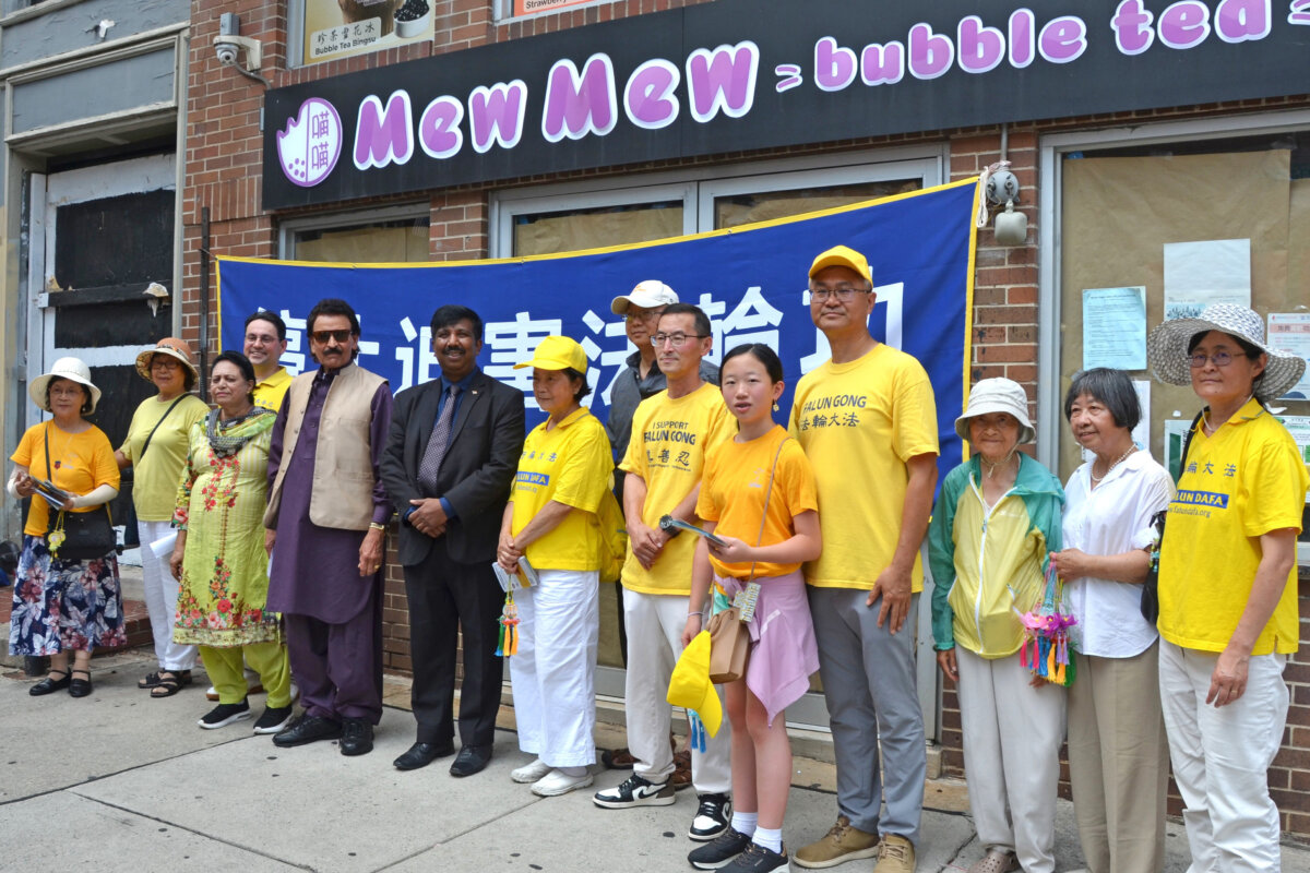 A rally commemorating the 26th anniversary of the Chinese Communist Party’s persecution of Falun Gong is held in Philadelphia's Chinatown on July 20, 2025. Aaron Bashir (6th L), president of American Real Voice PAC, joined the rally to show his support. (Frank Liang/The Epoch Times)
