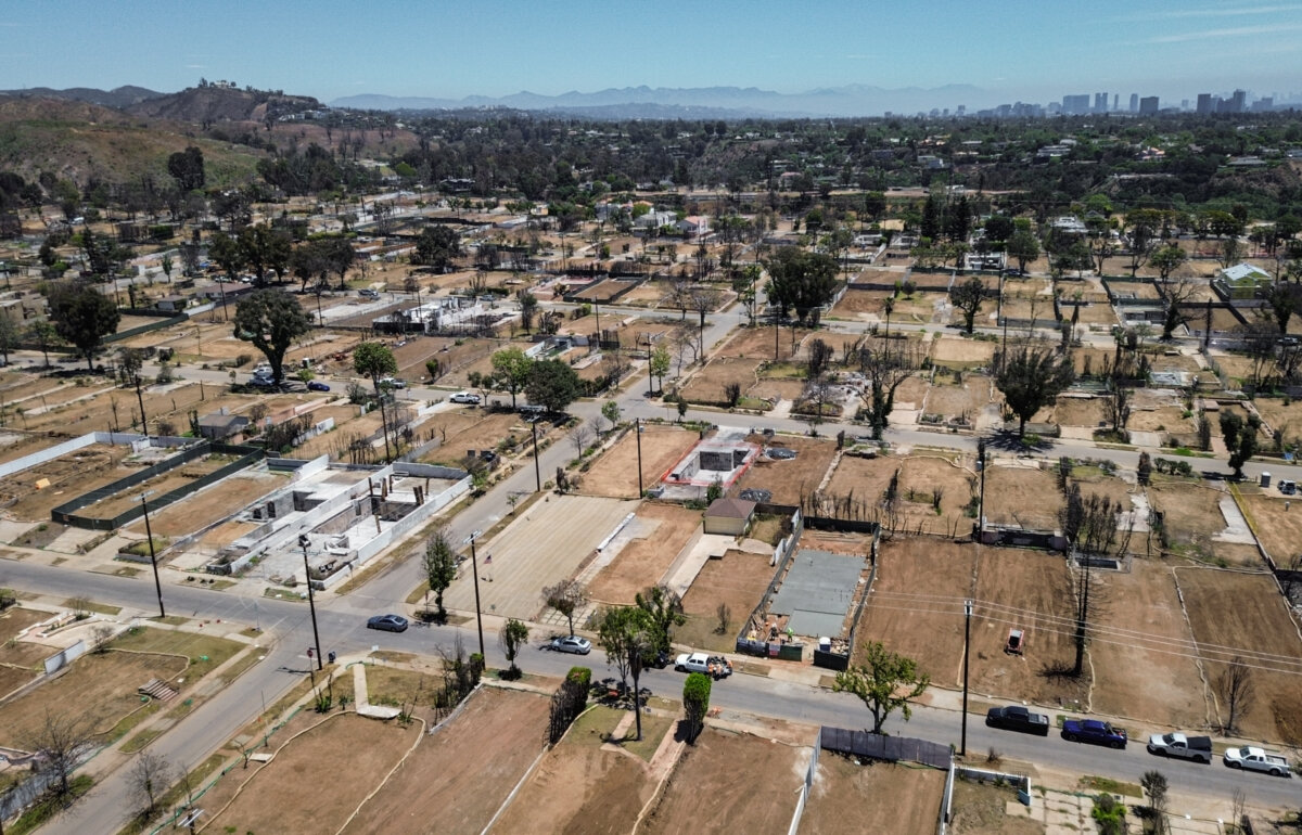 The cleared, vacant lots of homes burned during the Palisades fire are seen in the Pacific Palisades neighborhood of Los Angeles on June 9, 2025. (John Fredricks/The Epoch Times)
