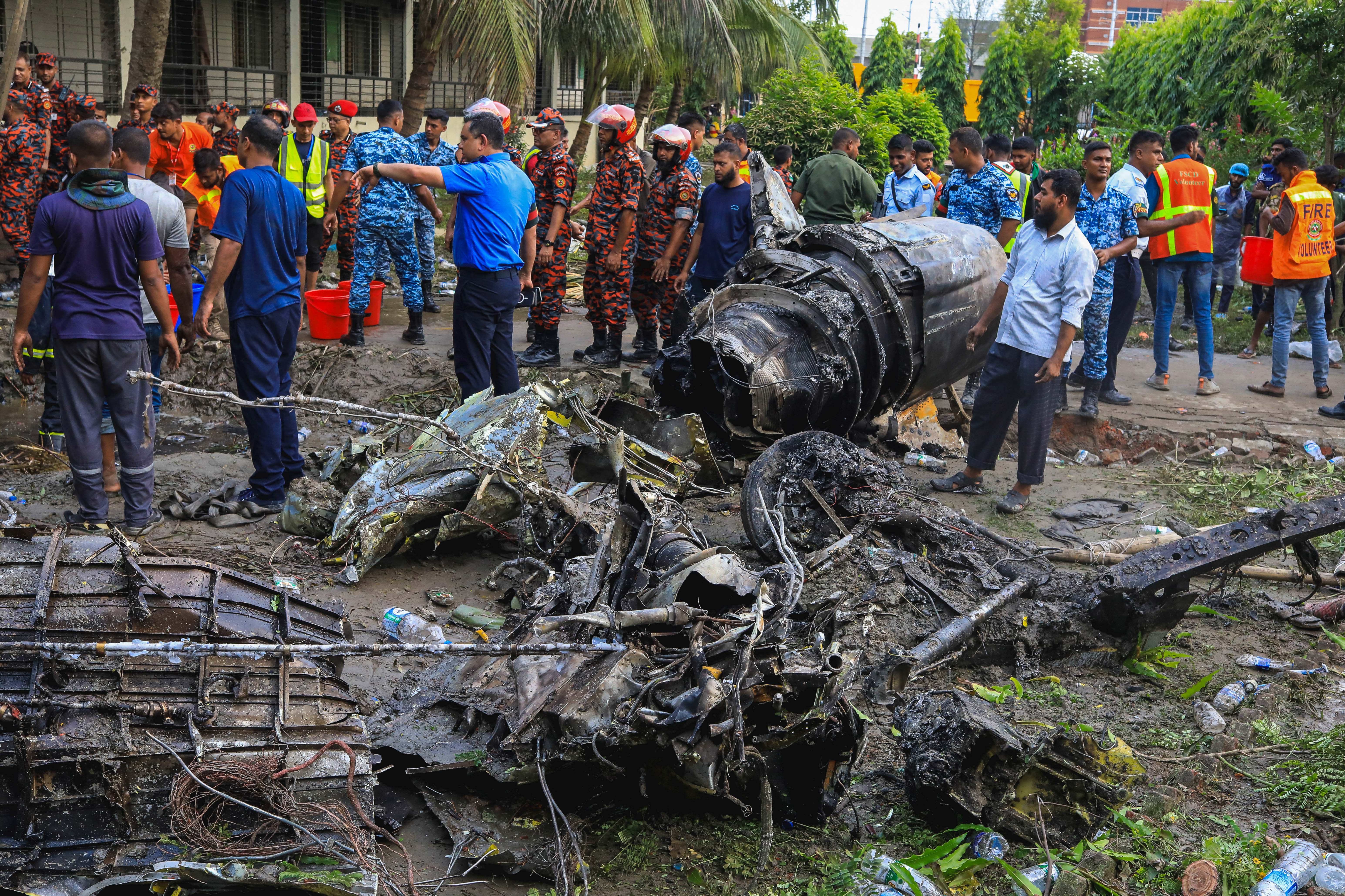 Day in Photos: Bangladesh Air Crash, Belgian National Day, and Releasing Turtles Into the Sea