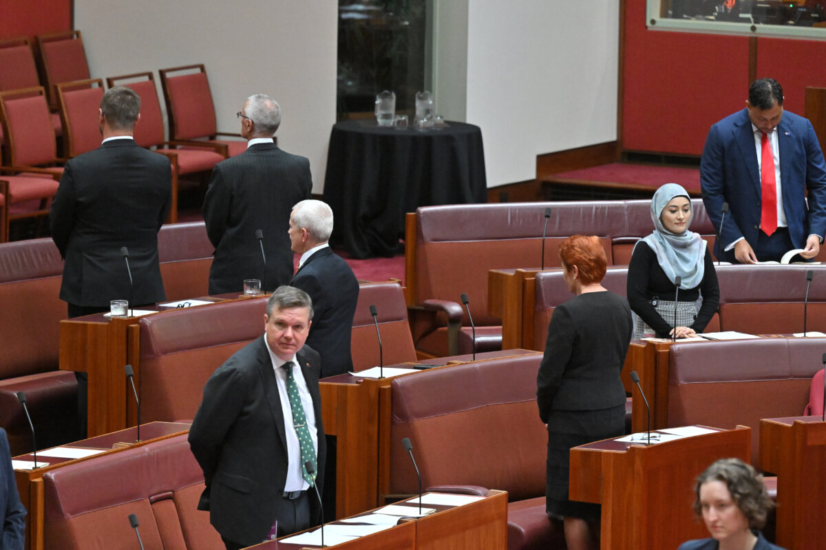 One Nation Senators Tyron Whitten, Warwick Stacey, Malcolm Roberts and Pauline Hanson turn their back on the Indigenous Acknowledgement to Country in the Senate chamber for the opening of the 48th Federal Parliament at Parliament House in Canberra, Australia on July 22, 2025. (AAP Image/Mick Tsikas)