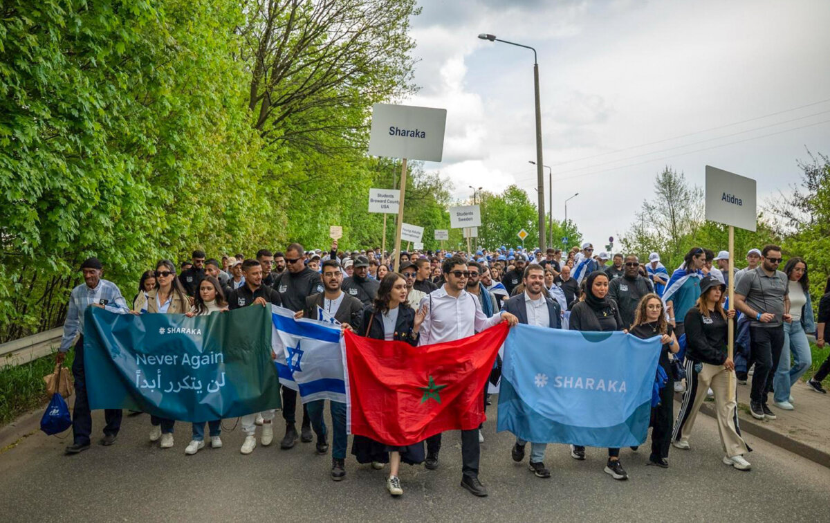 Sharaka delegates participate in the March of the Living, a two-mile walk from Auschwitz I to Auschwitz II, Poland, on April 24, 2025. (Courtesy of Sharaka)