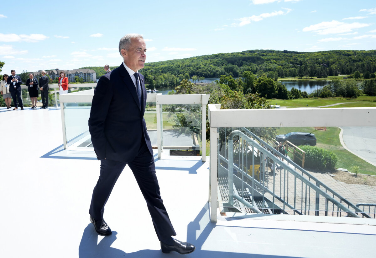 Prime Minister Mark Carney arrives for a press conference during a meeting of Canada's premiers at Deerhurst Resort in Huntsville, Ont., July 22, 2025. (The Canadian Press/Nathan Denette)