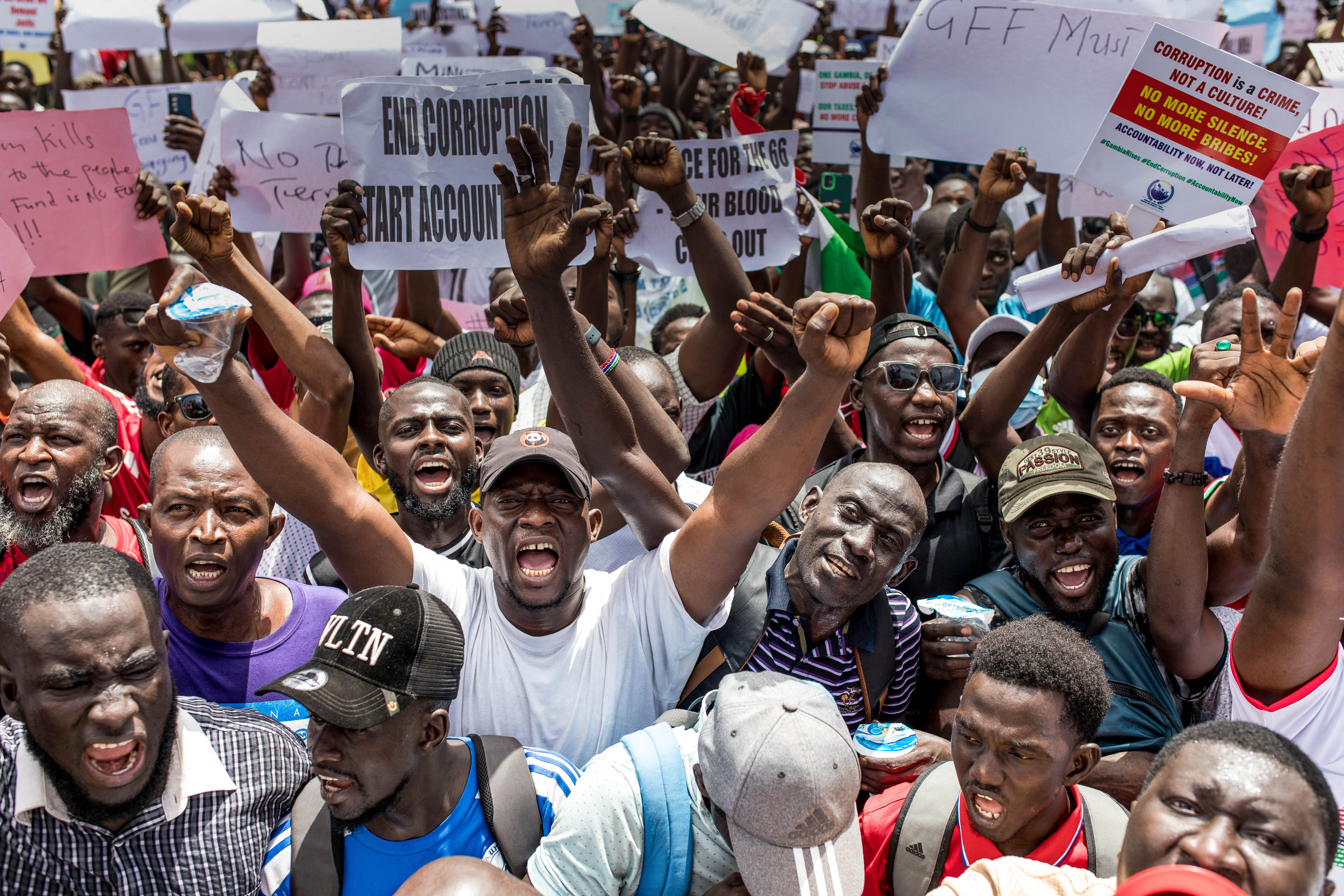 Day in Photos: Protests in Gambia, Detention of Illegal Immigrant, and Peace Talks Between Ukraine and Russia