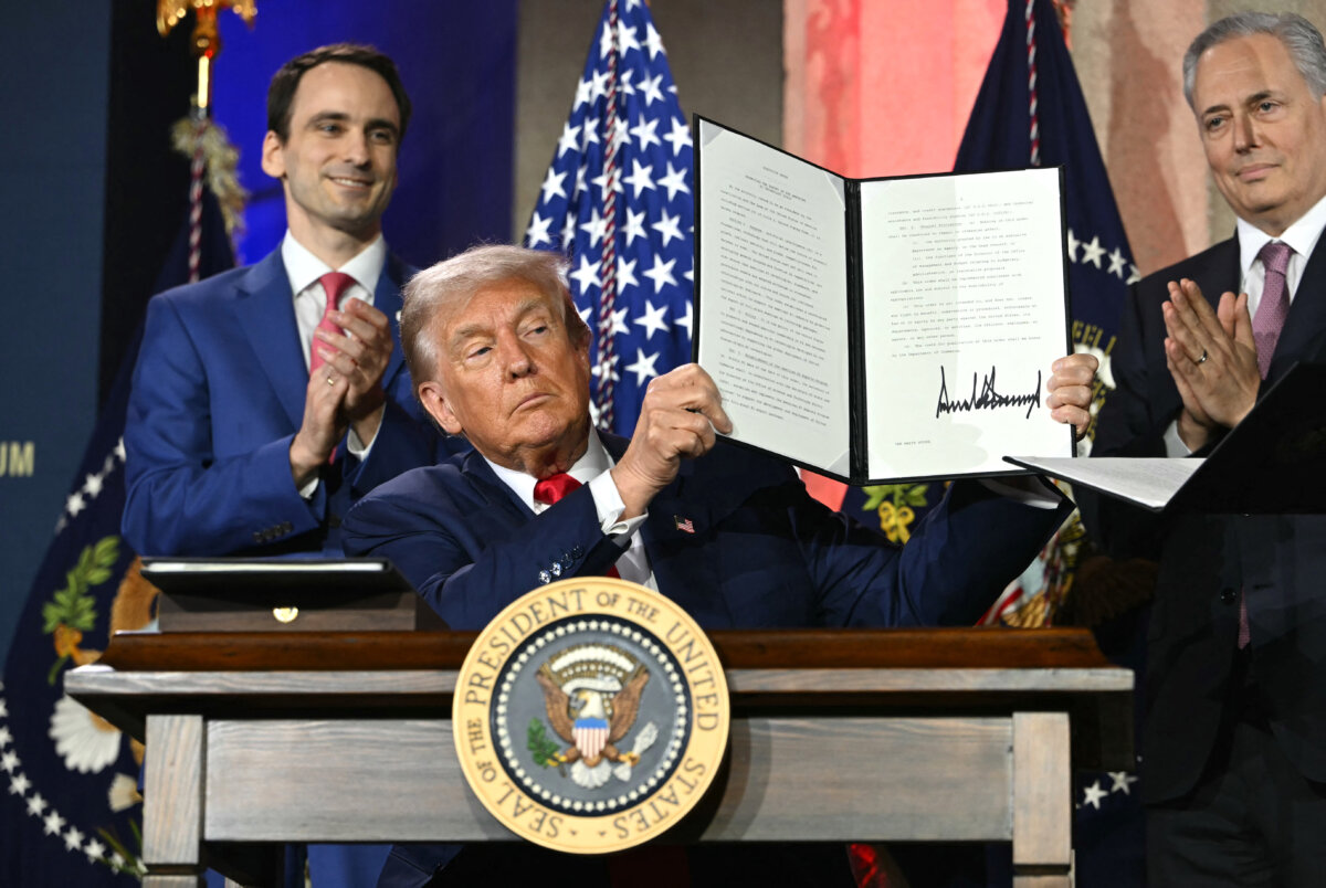 President Donald Trump displays an executive order on artificial intelligence he signed at the "Winning the AI Race" summit in Washington on July 23, 2025. (Andrew Caballero-Reynolds/AFP via Getty Images)