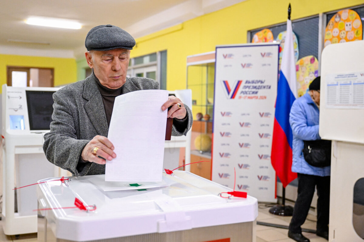 A man casts his ballot in Russia's presidential election at a polling station in Moscow on March 17, 2024. (Natalia Kolesnikova/AFP via Getty Images)