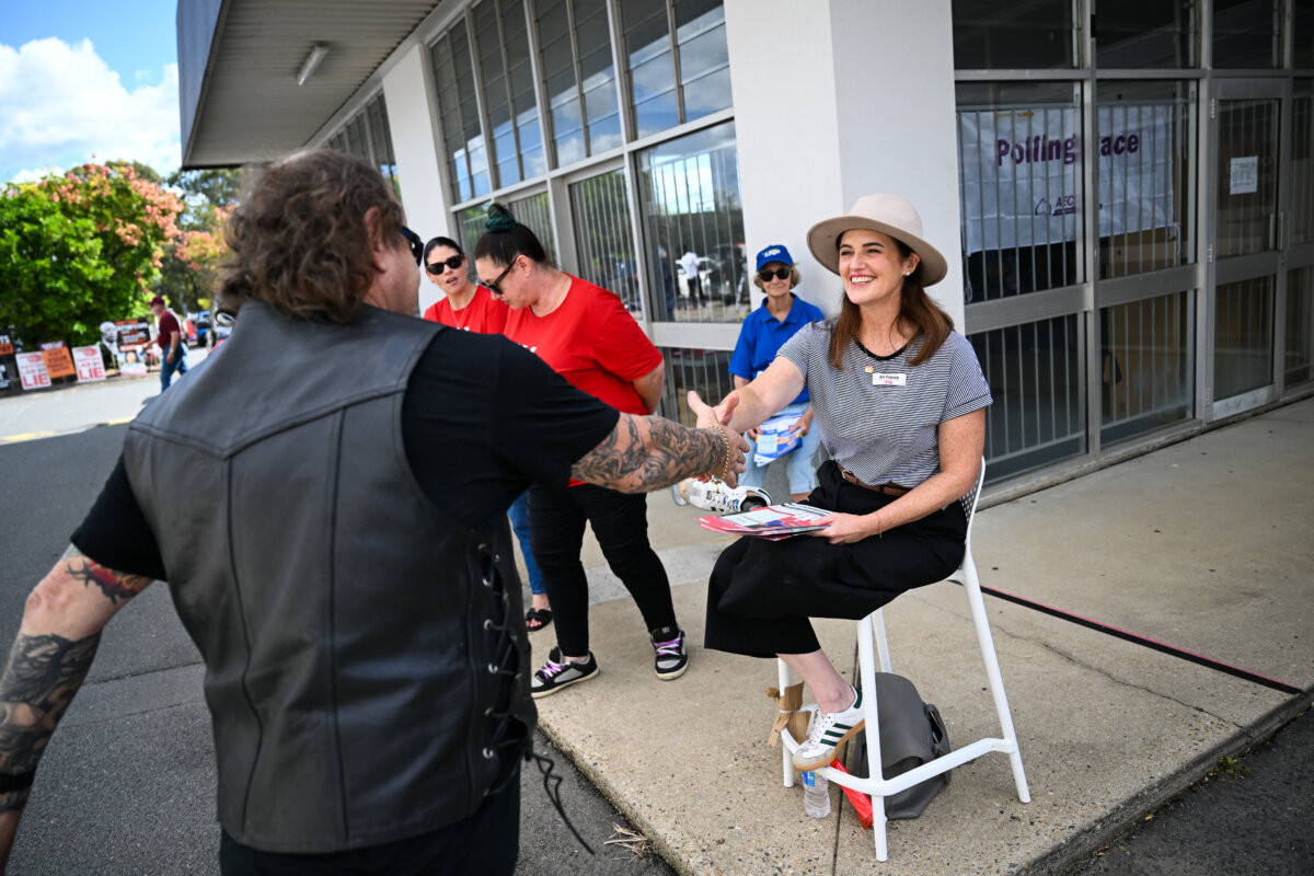 Ali France, Labor member for Dickson, greets voters at an early voting centre in the suburb of Strathpine in Brisbane, Australia on April 23, 2025. (Dan Peled/Getty Images)
