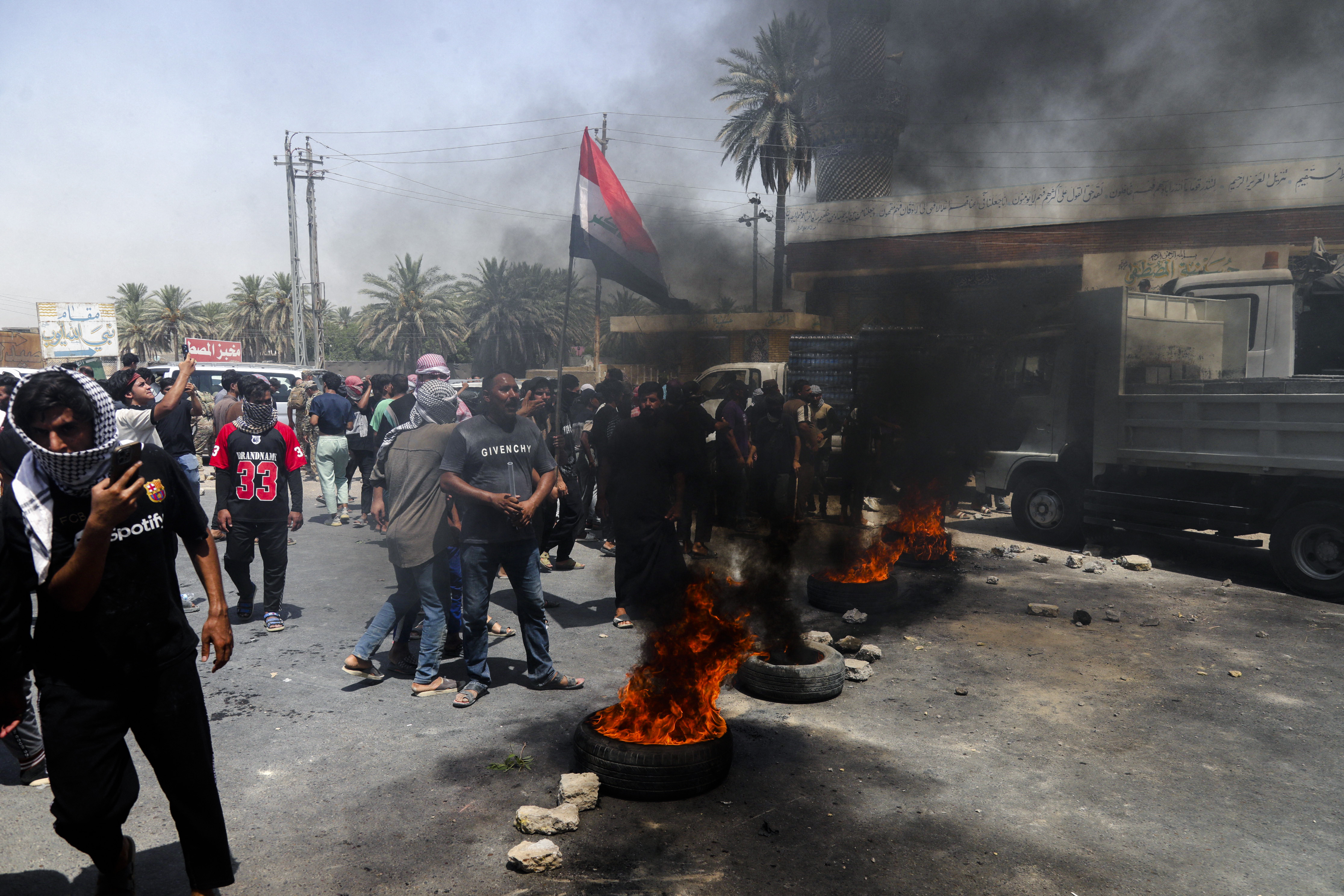 Day in Photos: Water Shortage in Iraq, Typhoon Co-May, and Heatwave in South Korea