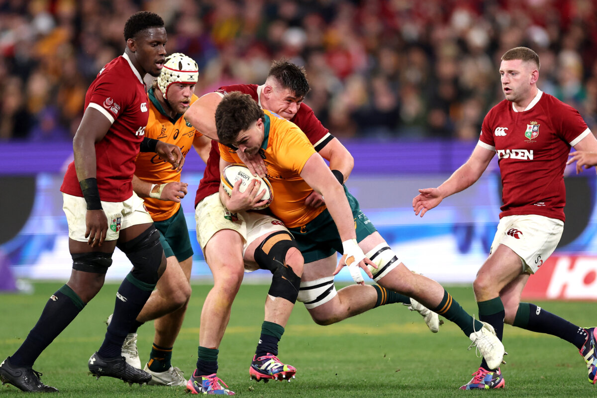 British and Irish Lions' Dan Sheehan tackles Australia's Jeremy Williams (C) during the second rugby Test match at the Melbourne Cricket Ground (MCG) on July 26, 2025. (Martin Keep/AFP via Getty Images)
