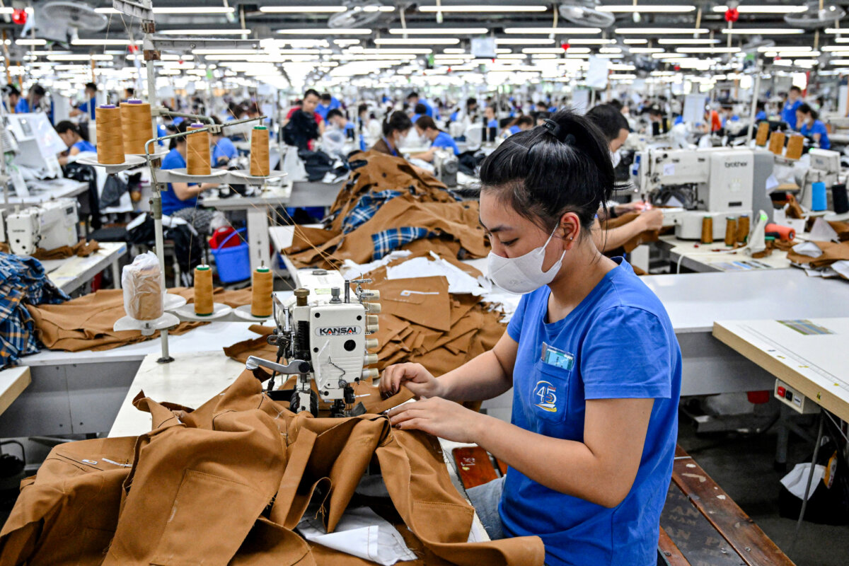 A worker stitches apparel at a garment factory in Thai Nguyen Province, Vietnam, on July 2, 2025. (Nhac Nguyen/AFP via Getty Images)
